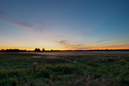 Fog over the meadow, view after sunset, Czulczyce, Poland