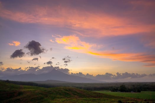 View of Colorful dramatic sky sunset or sunrise with clouds sky background,  Sky twilight with cloud in nature and travel