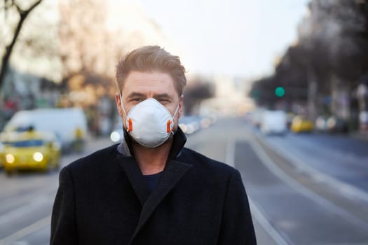 Coronavirus disease - man wearing face mask in a public to protect himself from the covid-19 virus.