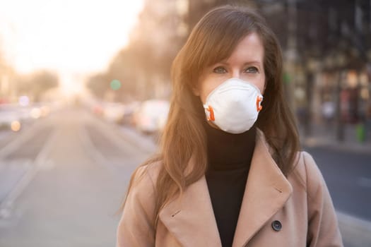 Coronavirus disease - woman wearing face mask in a public to protect herself from the covid-19 virus.