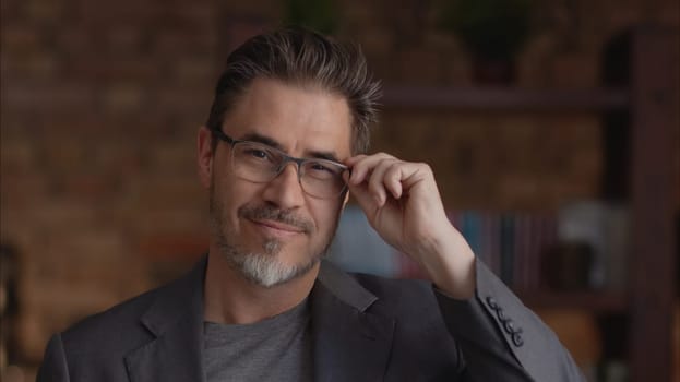 Confident businessman smiling in glasses. Portrait of mature age, middle age, mid adult man in 50s, happy confident smile. Copyspace.