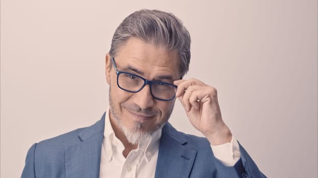 Business portrait - businessman smiling. Mature age, middle age, mid adult man in 50s with happy confident smile. Copy space.