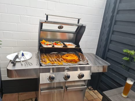 Grilled skewers with mixed vegetables served on a wooden cutting board with a vegan herb dip