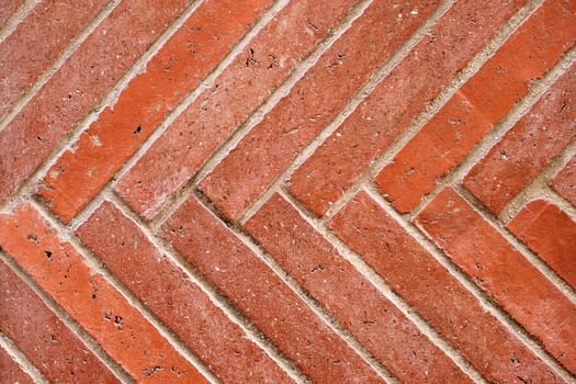 Background from a wall made of diagonal red clinker bricks