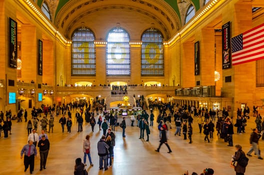 Grand Central Terminal indoors with lots of people walking around, long exposure, illuminated, horizontal