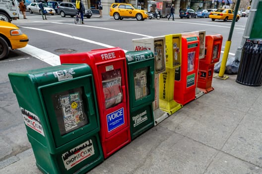 Different colored Newspaper Boxes in Manhattan, Green Chopsticks NY, Red Free Voice, Green Employment Guide, Metro, New York City, horizontal