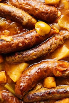 close up of rustic english sausage casserole comfort food background