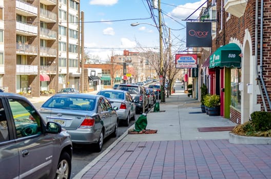Retail Stores at Cliffside Park Ozbar, Vertical Impressions, Pharmacy with parked cars in the forefront, New Jersey, during a sunny winter day, horizontal