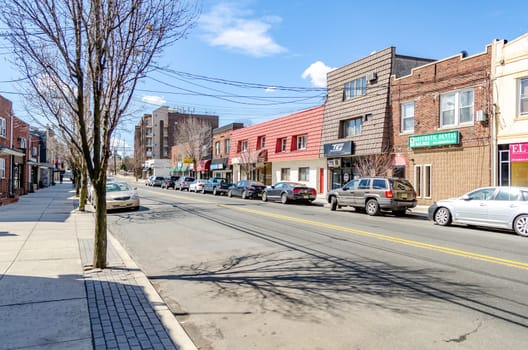 Retail Stores aesthetic dental, hair studio, Kumon, Tailor at Cliffside Park with parked cars in the forefront, New Jersey, during a sunny winter day, horizontal