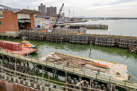 Ferry Terminal to Manhattan at Staten Island with wood jetty, New York City, during winter day with overcast, horizontal