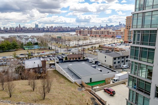 Harlem, Manhattan Skyline on the other side of Hudson river with Cliffside Park New Jersey in the forefront during a sunny winter day, horizontal