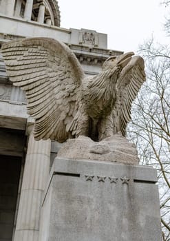 Eagle at General Grant National Memorial, Riverside Park, Harlem, New York City, low angle view, during winter day with overcast, vertical