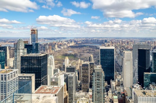 Central Park New York City aerial view from Rockefeller Center with hudson river and beautiful cloud sky during winter, horizontal