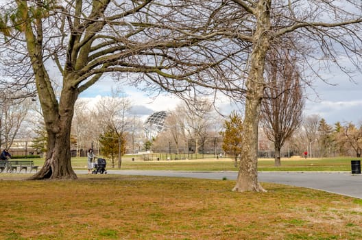 Unisphere Statue with meadow, trees and way in front, Flushing-Meadows-Park, Queens, New York City during overcast winter day, horizontal