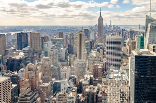 Manhattan Skyline with Empire State Building, aerial view, from Rockefeller Center, New York City during winter, horizontal