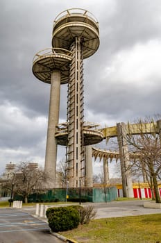 New York State Pavilion Observation Towers with Queens Theatre, view from low angle, Flushing-Meadows-Park, New York City during overcast winter day, vertical
