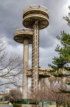 New York State Pavilion Observation Towers view from low angle, Flushing-Meadows-Park, New York City during overcast winter day, vertical