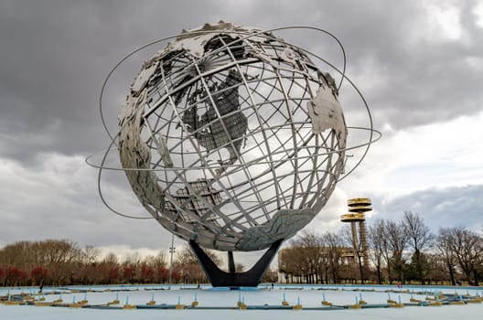 Unisphere with New York State Pavilion Observation Towers at Flushing-Meadows-Park, Queens, New York City during overcast winter day, horizontal