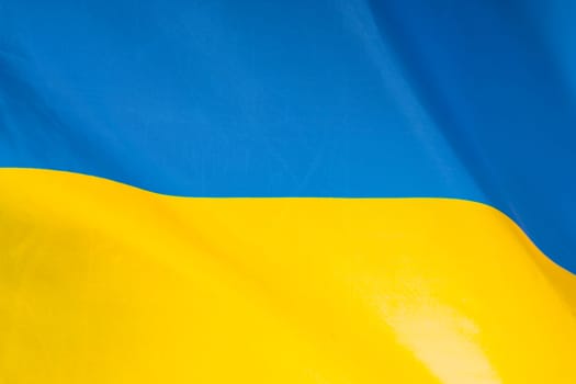 Flag of Ukraine. Blue and yellow colors. Close up shot, background