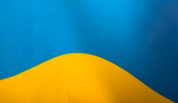 Flag of Ukraine. Blue and yellow colors. Close up shot, background