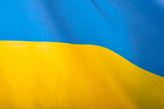 Flag of Ukraine. Blue and yellow colors. Close up shot, background