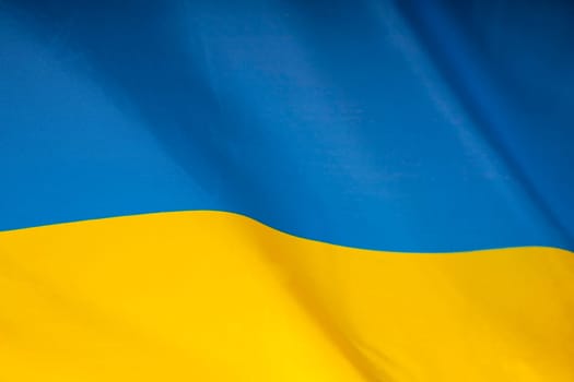 Flag of Ukraine. Blue and yellow colors. Close up shot, background