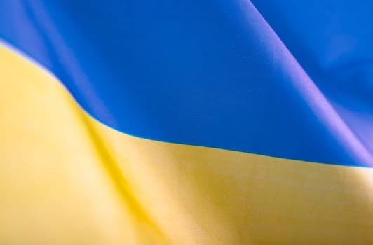 Flag of Ukraine. Blue and yellow colors. Close up shot, background