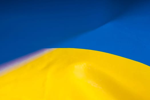 Flag of Ukraine. Blue and yellow colors. Close up shot, background