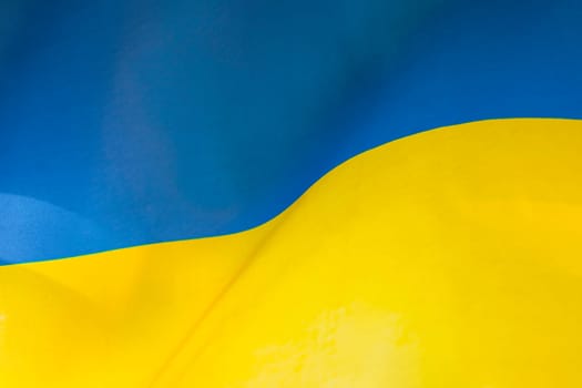 Flag of Ukraine, UA. Blue and yellow colors. Close up shot, background