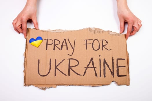 Pray for Ukraine concept background. Concept symbol of help support and no war in the country of Ukraine.