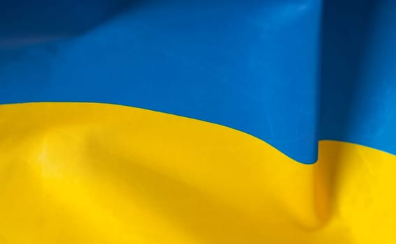 Flag of Ukraine. Blue and yellow colors. Close up shot, background