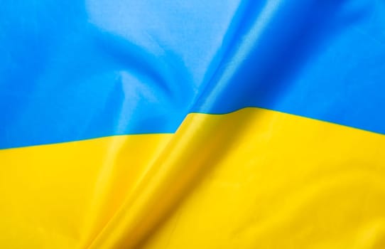 Flag of Ukraine. Blue and yellow colors. Close up shot, background