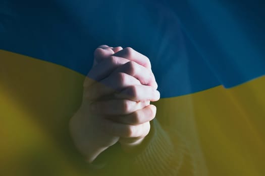 Pray for Ukraine concept background. National Ukrainian flag. Concept symbol of help support and no war in the country of Ukraine.
