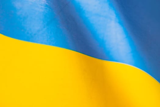 Flag of Ukraine, UA. Blue and yellow colors. Close up shot, background