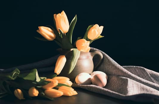 Beautiful Easter still life with fresh tulips and painted eggs