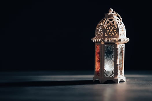 Ramadan Kareem background. Ornamental Arabic lantern glowing at night