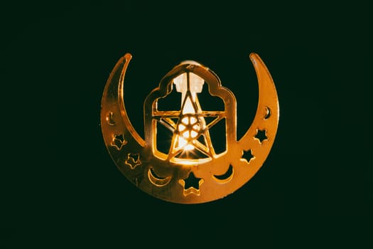 Ramadan Kareem background. Ornamental Arabic lantern glowing at night