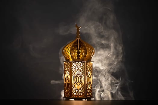 Ramadan Kareem background. Ornamental Arabic lantern glowing at night