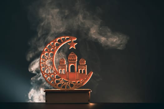 Ramadan Kareem background. Ornamental Arabic lantern glowing at night