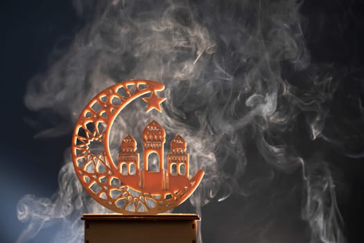 Ramadan Kareem background. Ornamental Arabic lantern glowing at night