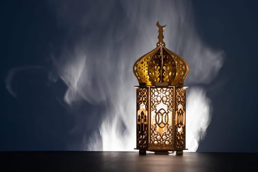 Ramadan Kareem background. Ornamental Arabic lantern glowing at night