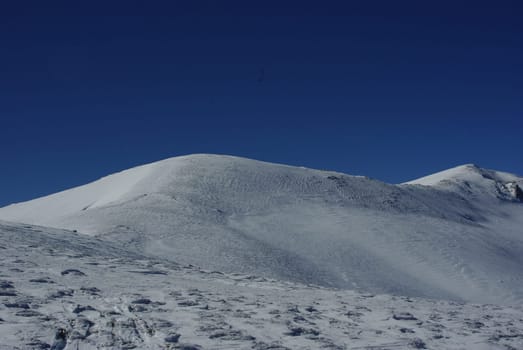 mountains with covered snow and mountaineer