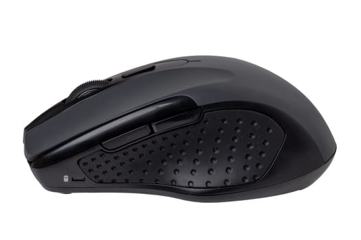 Wireless black computer mouse isolated on a white background. Home office, remote work during corona pandemic. Clipping path. Macro.