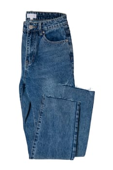 Woman jeans isolated. Folded trendy stylish female blue jeans trousers isolated on a white background. Clipping path. Fashionable denim pants for women.