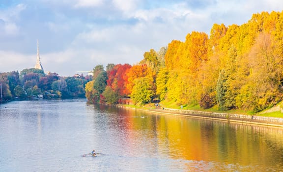 Turin, Piedmont Region, Italy - Circa November 2021: landscape in autumn with Po' river and blue sky.