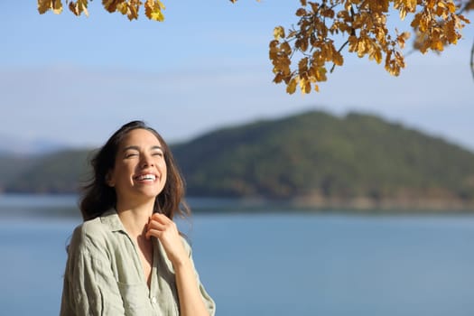 Funny woman looking up in a lake on vacation