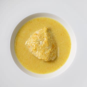 Curry chicken with coconut milk in a plate