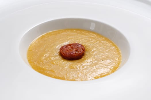Polenta corn grain with parmesan cheese and sausage close-up