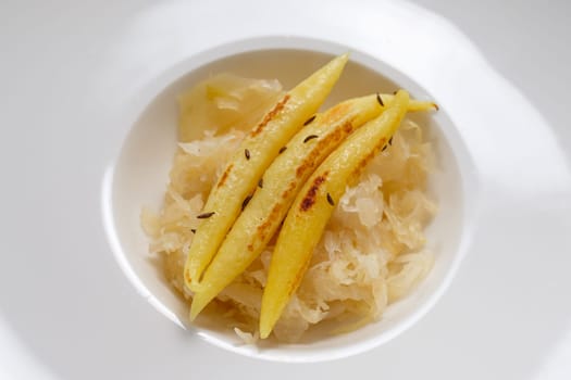 Finger-shaped potato dumplings on Sauerkraut dish in a restaurant