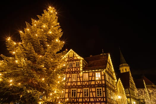 Christmas tree with half-timbered house and church in Germany